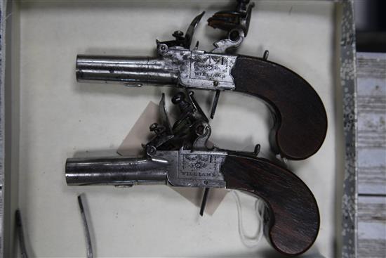 A pair of George III flintlock pocket pistols by Williams, c.1800,